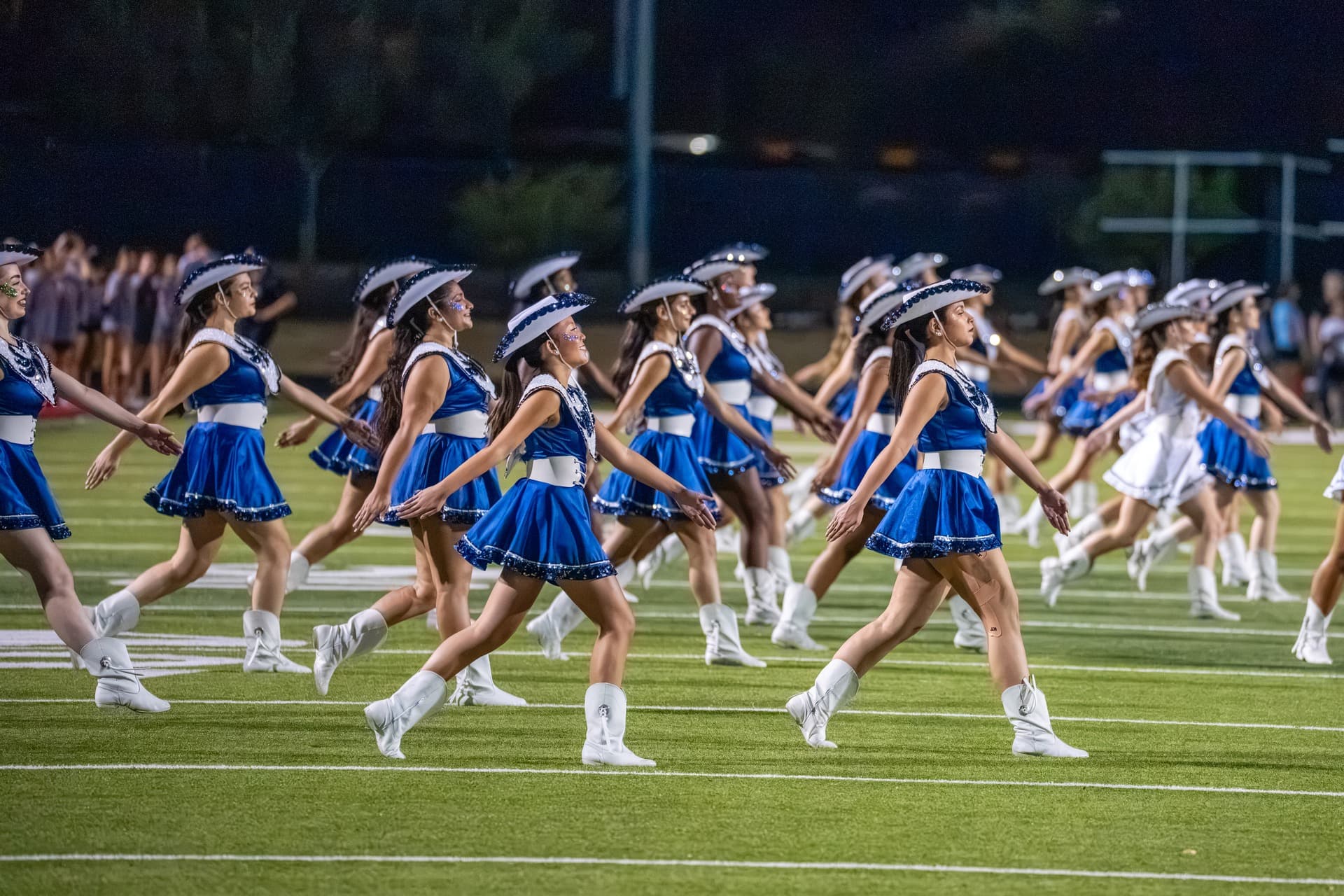 McNeil drill team performing on the field during a football game